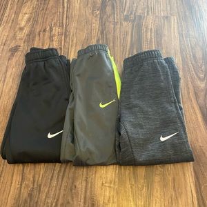 3 pairs of nike sweatpants.